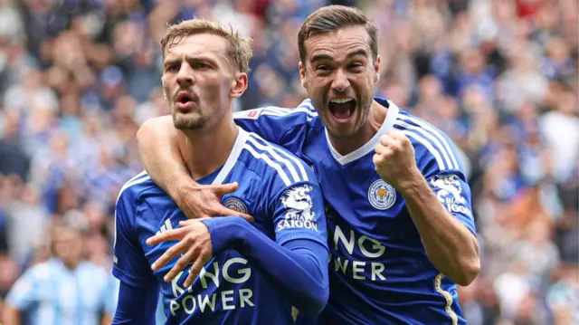 Kiernan Dewsbury-Hall and Harry Winks celebrate a goal for Leicester