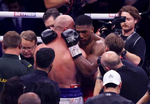 Anthony Joshua hugs Robert Helenius