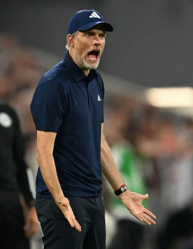 Thomas Tuchel throws his arms out in frustration.