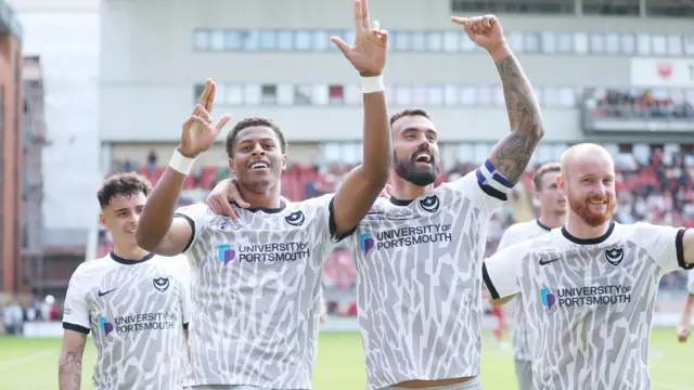 Portsmouth celebrate their win at Leyton Orient