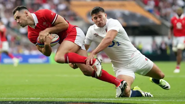 Tomos Williams crashes over the line as Ben Youngs attempts to tackle him