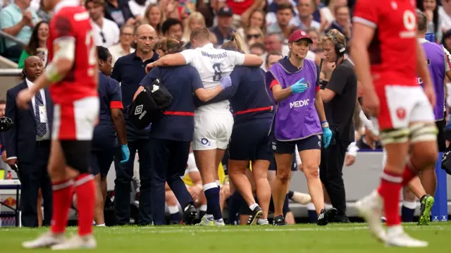 England's Jack van Poortvliet is helped off the field