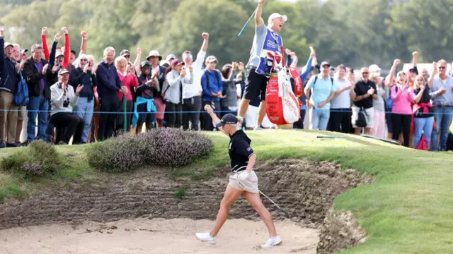 Charley Hull holes a bunker shot on 11