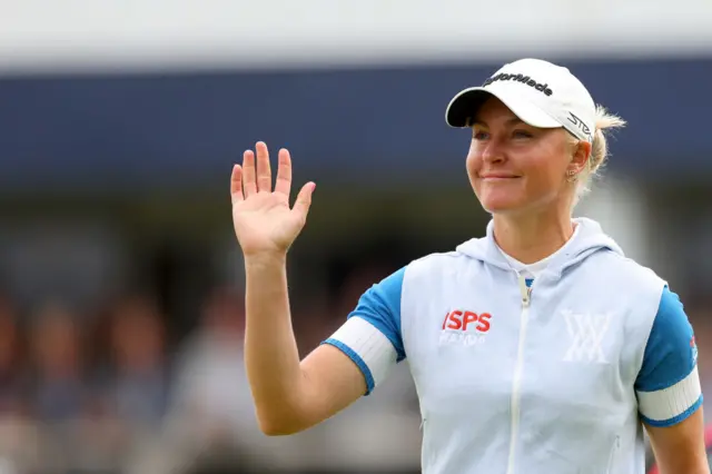 Charley Hull waves to the crowd at the Women's Open