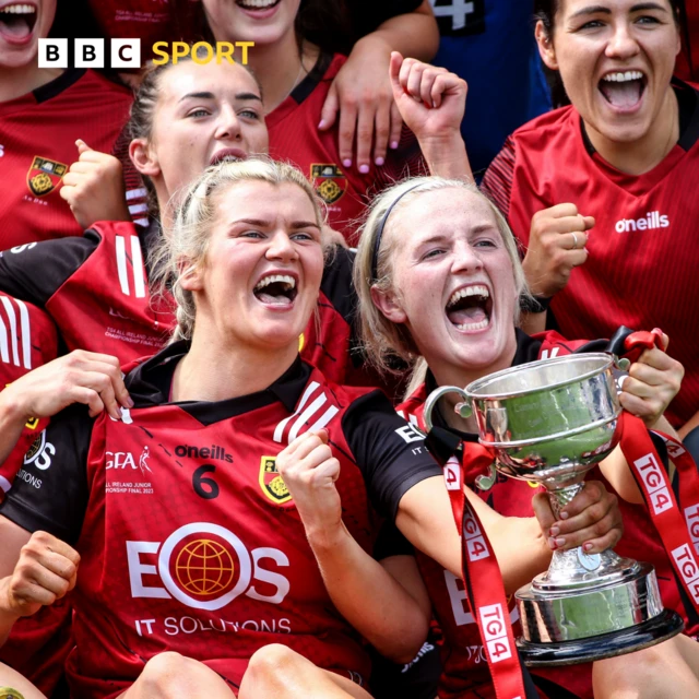 Down players celebrate with the cup after the game