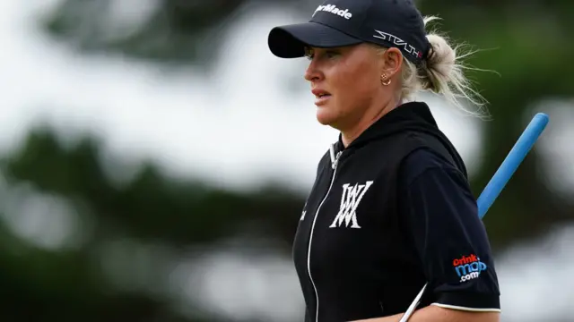 Charley Hull lines up a putt