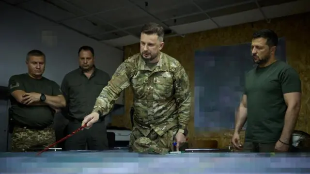 Ukraine's President Volodymyr Zelensky with a Ukrainian armed forces officer in Soledar, near Bakhmut