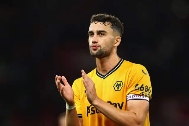 Wolves Captain Kilman applauds the fans.