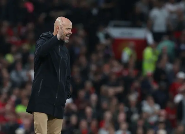 Ten Hag shouts at his players from the touchline.