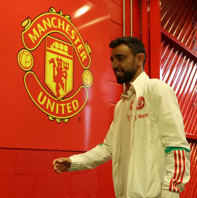 Bruno Fernandes walks along the tunnel at Old Trafford.