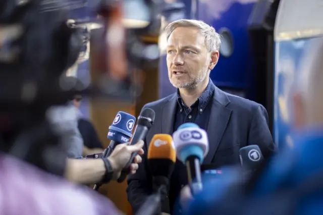 Christian Lindner speaks to reporters