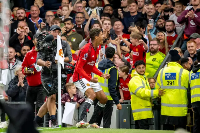 Varane celebrates with the fans.