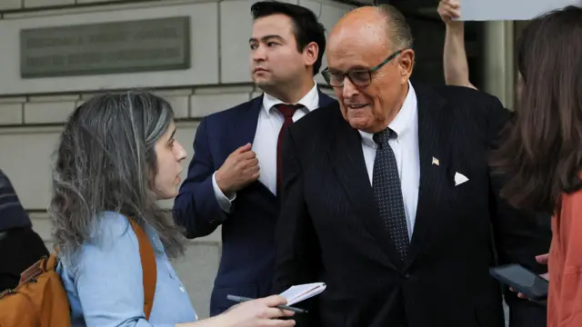 Rudy Giuliani speaking to reporters in May 2023