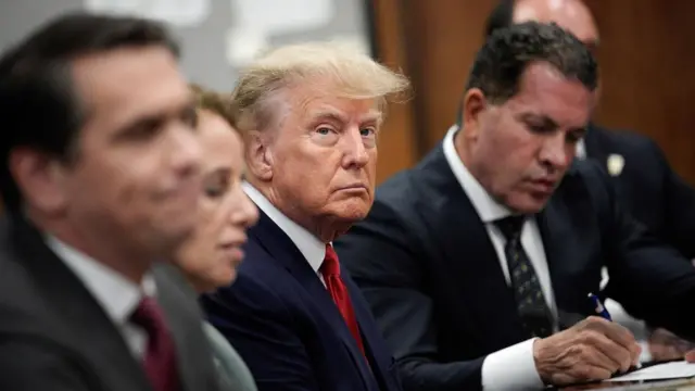 Former US President Donald J. Trump sits in the courtroom for his arraignment in New York Criminal Court in New York, New York, USA, 04 April 2023.