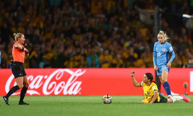 Sam Kerr asking for a booking after being taken out by Greenwood.