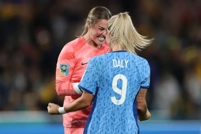 Mary Earps and Rachel Daly celebrate at full time.