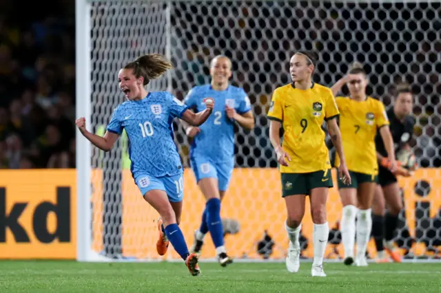 Ella Toone cheers with fists in the air after she scores the opening goal.