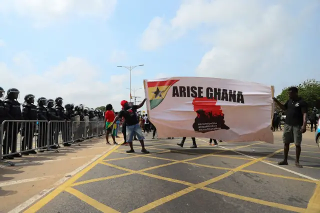 Protesters march towards the Presidential Palace on the second day of a demonstration over soaring living costs in Accra, Ghana, on June 29, 2022