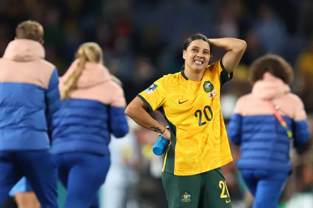 Sam Kerr grimaces as the pain of defeat sets in.