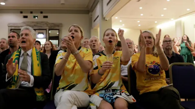 The Australian high commissioner watches on with family in london.