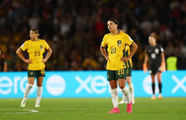 Sam Kerr stands with her hands on her hips after England take the lead again.