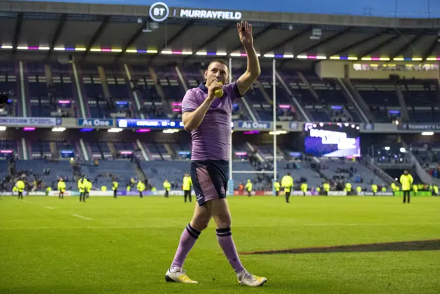 Finn Russell waves to fans