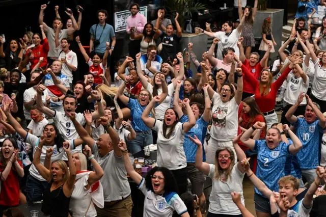 England fans react to England second goal as they watch a screen showing the Women's World Cup semi-final football match between Australia and England, at Boxpark Wembley