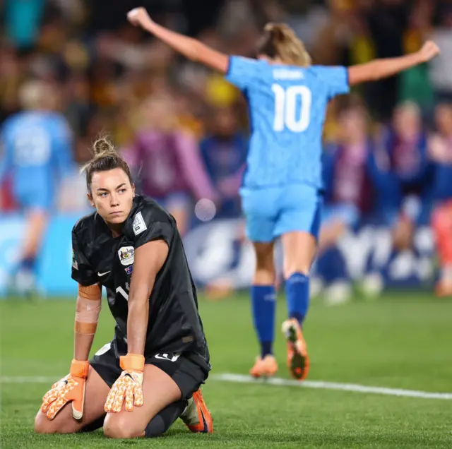 Mackenzie Arnodl sinks to her knees at full time.