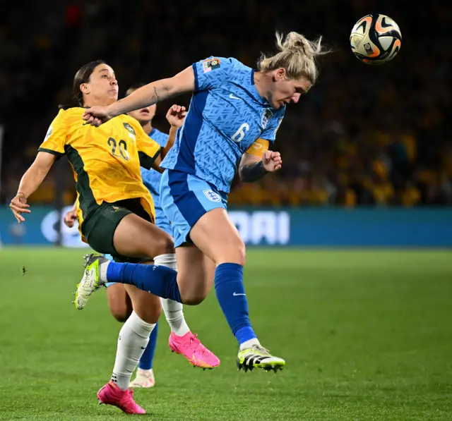 Bright gets to the header ahead of Sam Kerr.