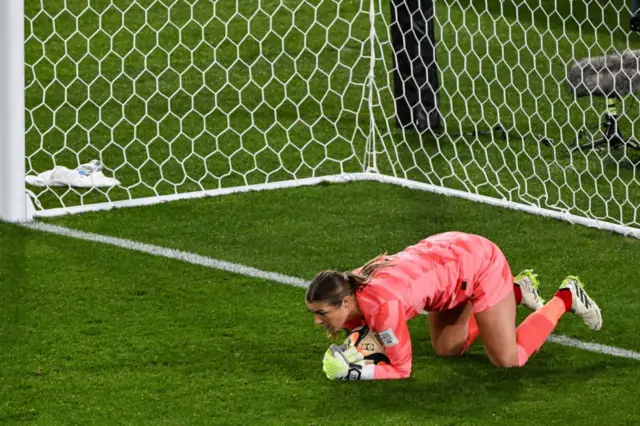 Mary Earps drops onto the ball to give her side a minute's rest.