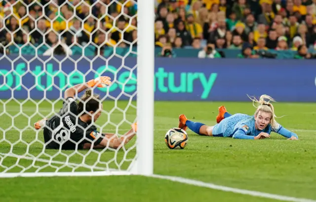 Hemp lies on the floor after seeing her diving header saved.