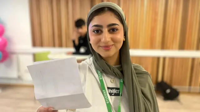 Student Humaira proudly shows off her results