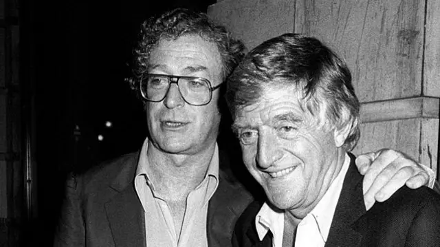 Michael Caine and Michael Parkinson at Langan's Brasserie in London in 1987