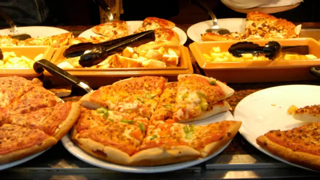 A stock image of pizzas on plates