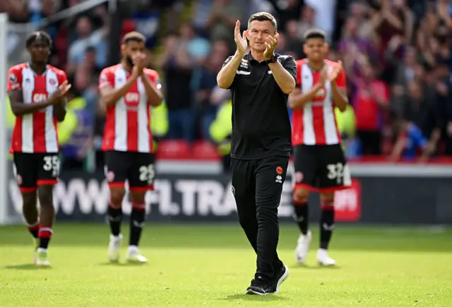 Paul Heckingbottom applauds the fans