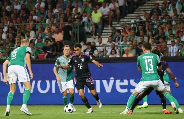 Jamal Musiala in control of the ball attacking Werder Bremen