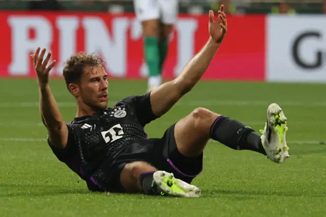 Leon Goretzka on the floor after being fouled