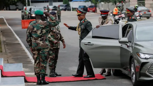 Military personnel arrive at the headquarters of the Ghana Armed Forces, 17 August 2023.