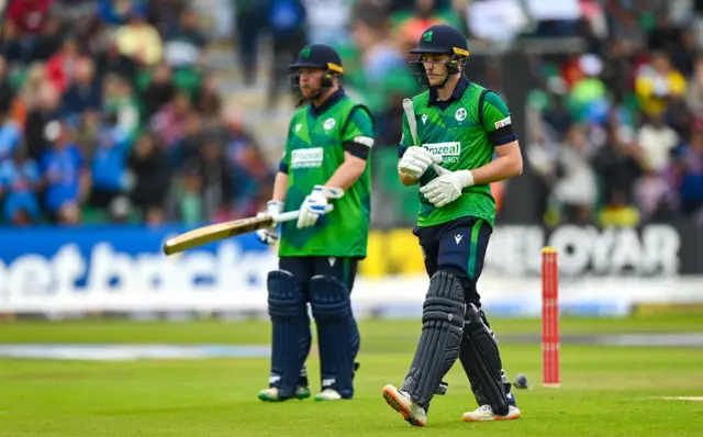 Ireland batter Lorcan Tucker (right) after being caught by India wicketkeeper Sanju Samson