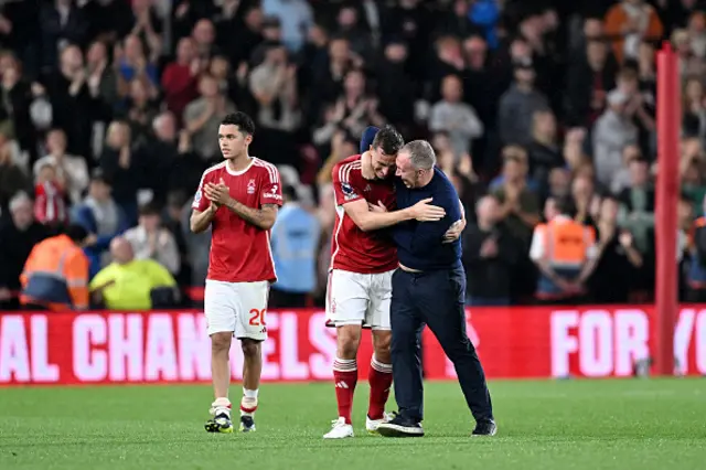 Chris Wood and Steve Cooper celebrate together after the game