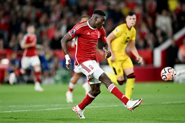 Taiwo Awoniyi dinks a shot over Wes Foderingham