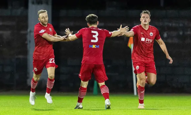 Greig Spence (left) high-fives Cameron Clark (centre) with Jordan McGregor (right)