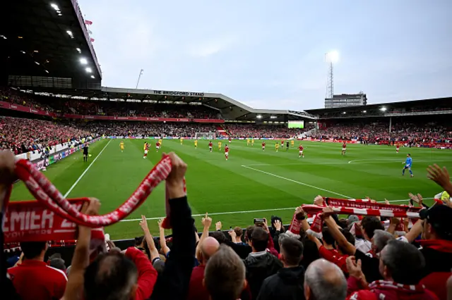 Nottingham Forest rans raise their scarfs during the game