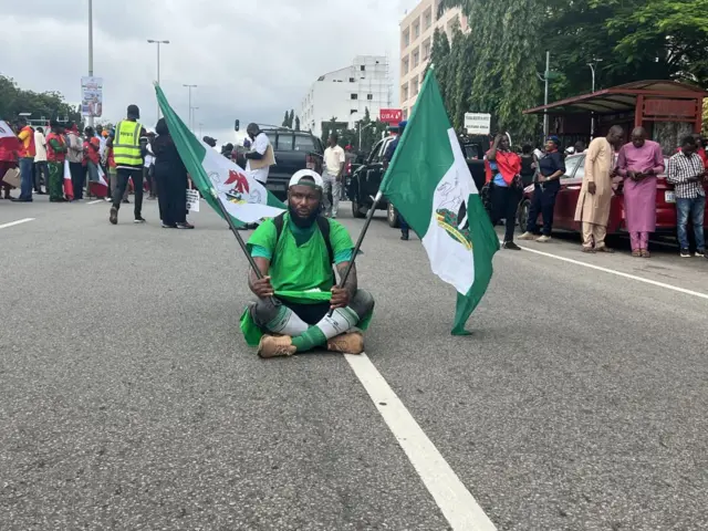 People gather to protest against the increase in fuel prices and the cost of living in Abuja, Nigeria on 2 August 2023