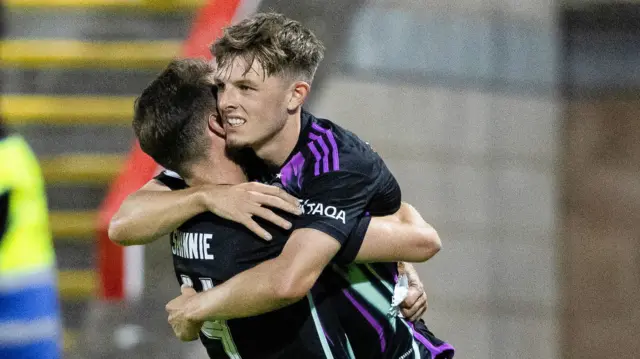 Leighton Clarkson is hugged by Graeme Shinnie after scoring the winner