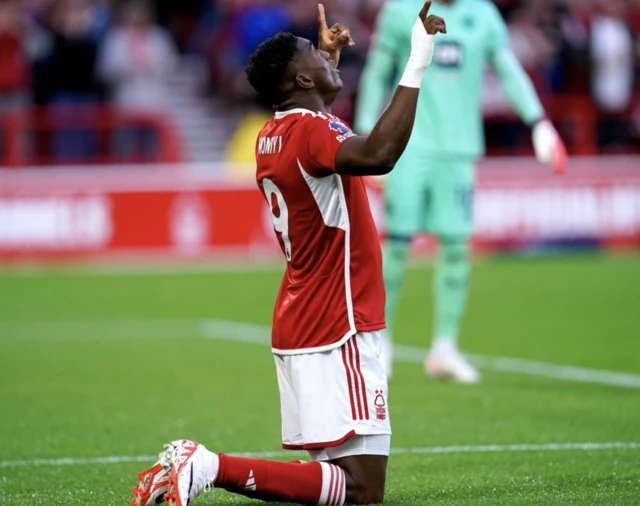 Taiwo Awoniyi on his knees celebrating his goal