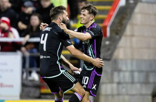 Graeme Shinnie hugs Leighton Clarkson