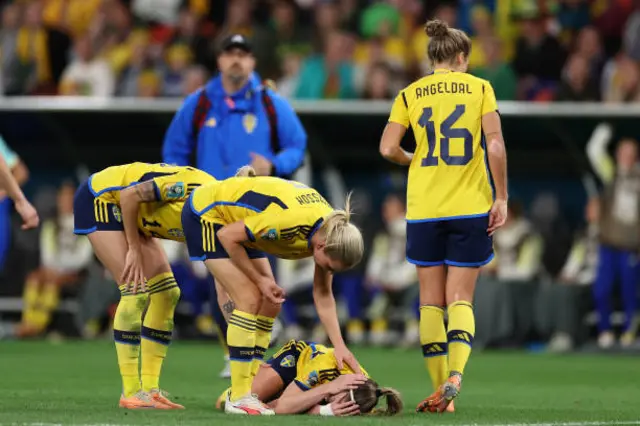 Kosovare Asllani of Sweden lies on the pitch