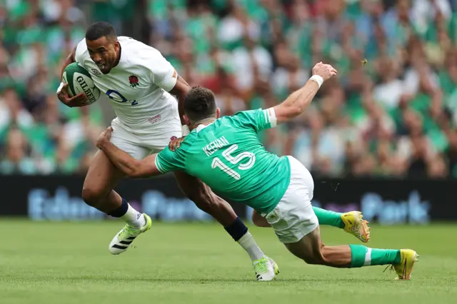 England's Anthony Watson is tackled by Ireland's Hugo Keenan