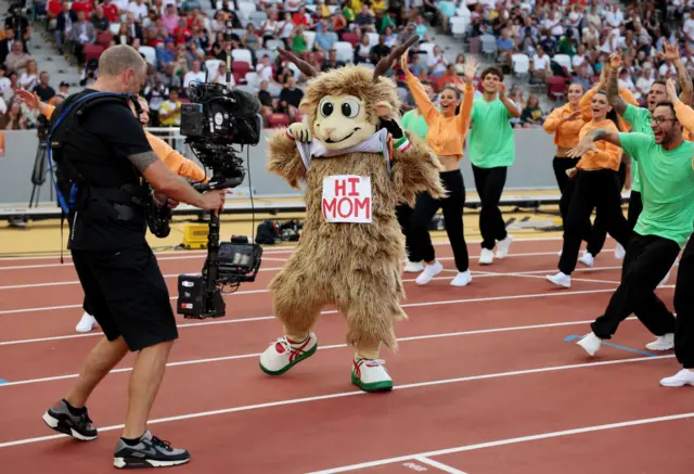 The mascot dances